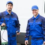 Happy Pest Control Workers Infront Of Van