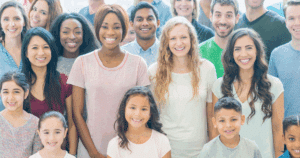 Diverse community members smiling together, showcasing successful franchise community engagement through inclusive local connections