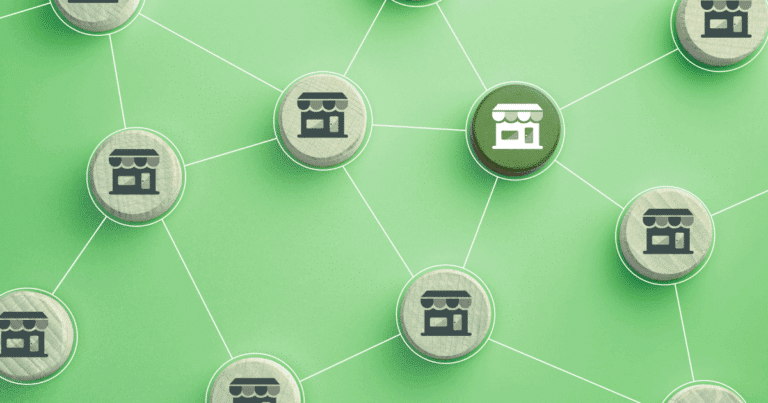 Network of interconnected franchise store icons on green background illustrating multi-unit franchise growth strategy.