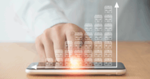 Person tapping smartphone with digital franchises icons growing in upward trend graph overlay.