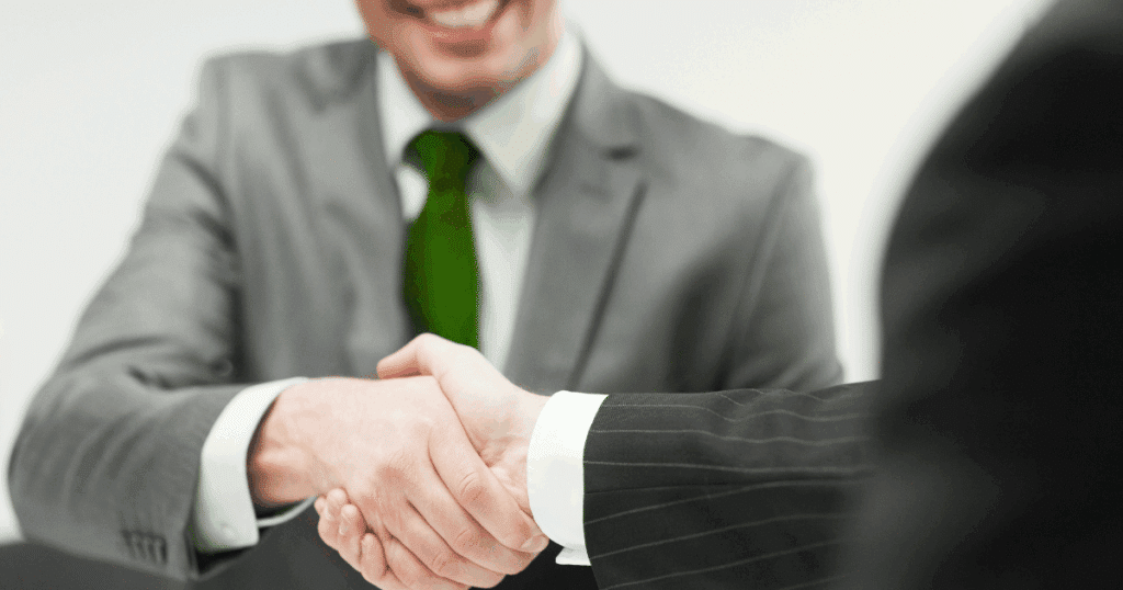 Business owner partnering with franchise compliance consulting expert to ensure legal growth.