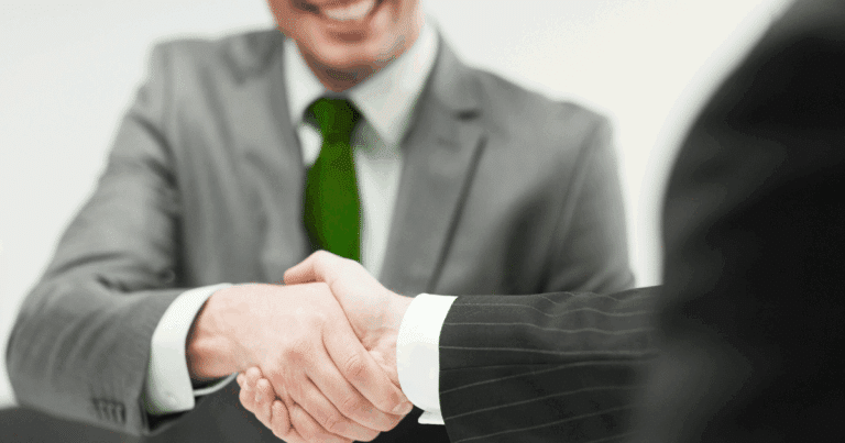 Business owner partnering with franchise compliance consulting expert to ensure legal growth.