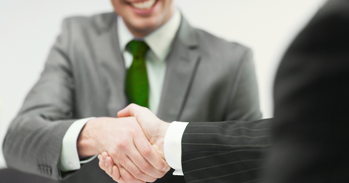 Business owner partnering with franchise compliance consulting expert to ensure legal growth.