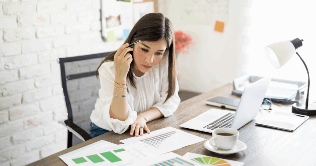 Business team conducting franchise competitor analysis with charts and market research data.