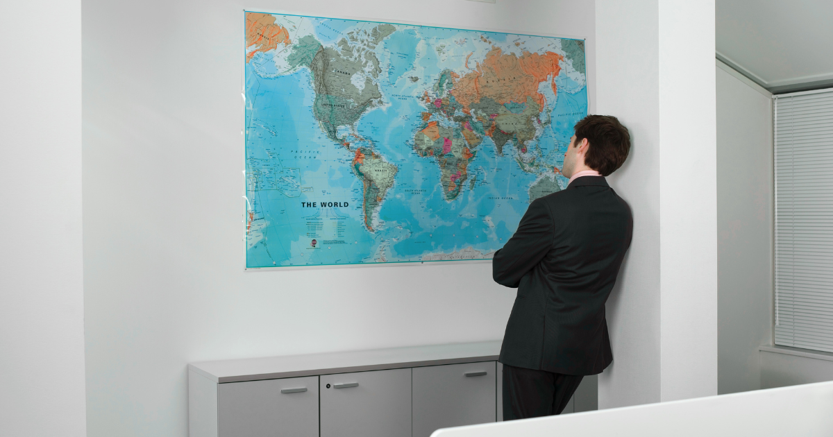 Business owner reviewing global markets to support Data-Driven Growth and strategic franchise location planning