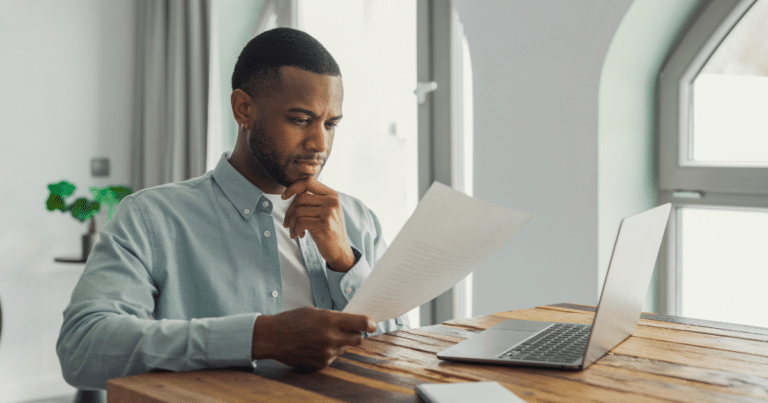 Business owner reviewing franchise registration documents